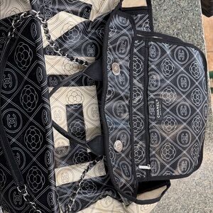 CHANEL Black and Cream Floral Logo Bag